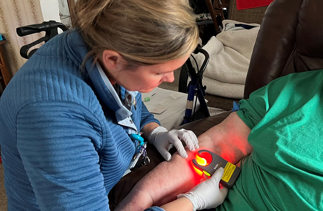 female medical provider takes a patient's vitals