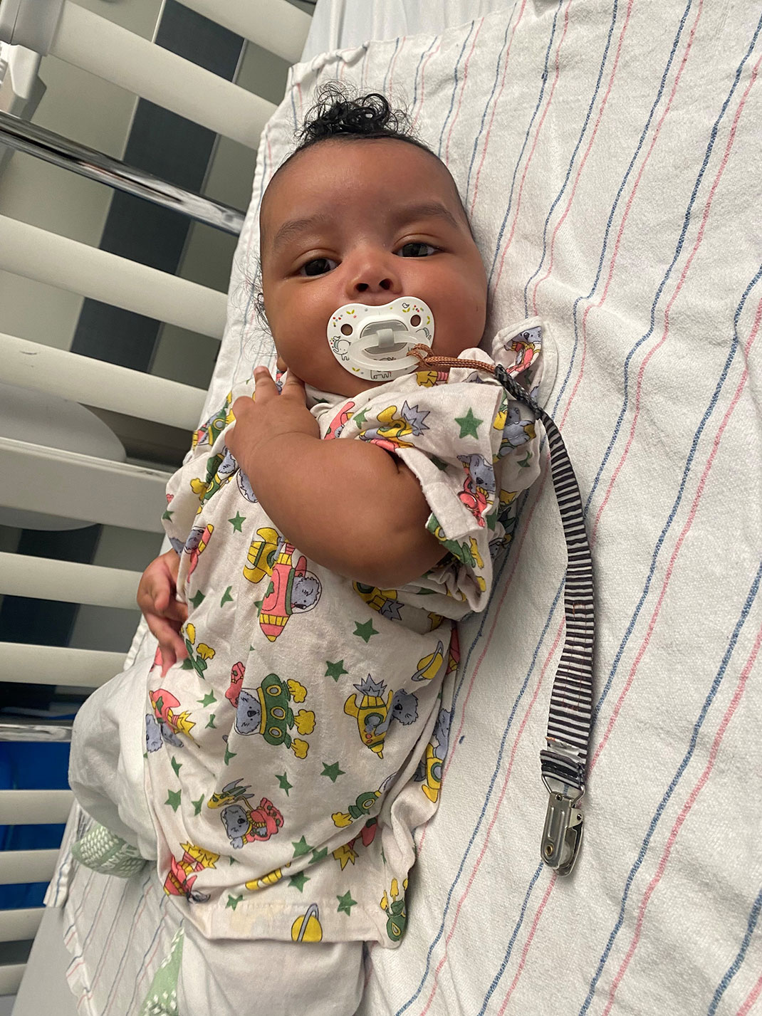 Infant Lamar Carter Jr. in his crib